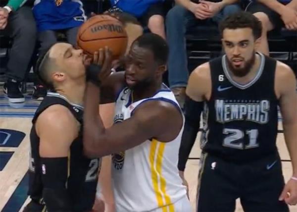 Grizzlies guard Dillon Brooks (L) and Warriors big man Draymond Green get chippy during a game in Memphis on March 9, 2023.