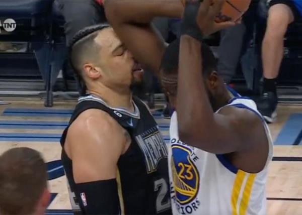 Grizzlies guard Dillon Brooks (L) and Warriors big man Draymond Green get chippy during a game in Memphis on March 9, 2023.