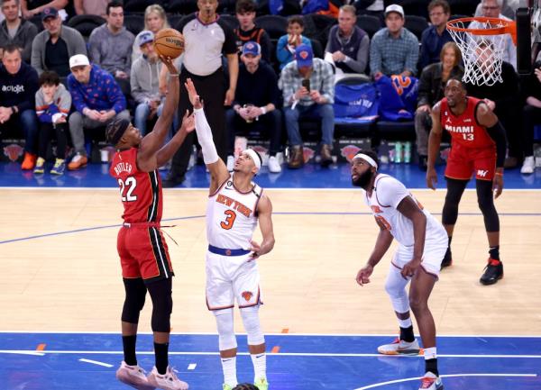 Jimmy Butler of the Heat (22) shoots against the Knicks' Josh Hart in Game 1 of the second round on April 30, 2023.