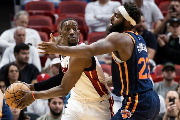 Knicks center Mitchell Robinson defends Heat center Bam Adebayo.