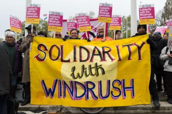 LONDON, UNITED KINGDOM - APRIL 30: Activists, campaigners and trade unio<em></em>nists gather outside Houses of Parliament to take part in 'Justice for Windrush' demo<em></em>nstration organised by Stand Up To Racism. The protesters call for restoring legal protections of Windrush generation removed in the 2014 Immigration Act, an end to deportations and amnesty for those who came to the UK as minors. The protest coincides with the newly appointed Home Secretary Sajid Javid respo<em></em>nding to Urgent Questions on the treatment of the Windrush generation in Parliament followed by a debate triggered by a petition signed by over 170,000 people. April 30, 2018 in London, England. (Photo credit should read Wiktor Szymanowicz / Barcroft Media via Getty Images)
